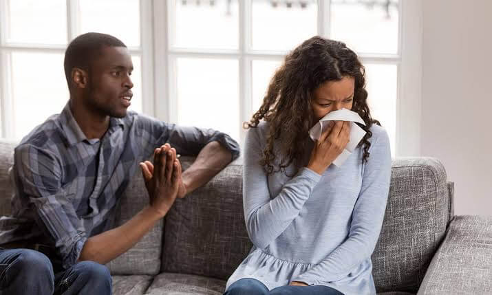 A man is asking a woman for forgiveness