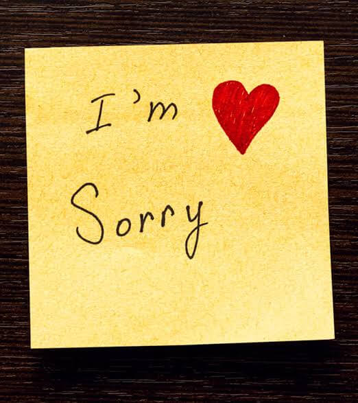 A sticky note that says I am sorry