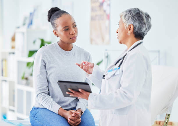 a doctor is talking with a woman