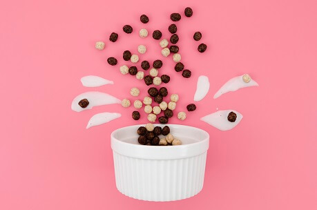 Cute cartoon arrangement with milk and chocolate cereals